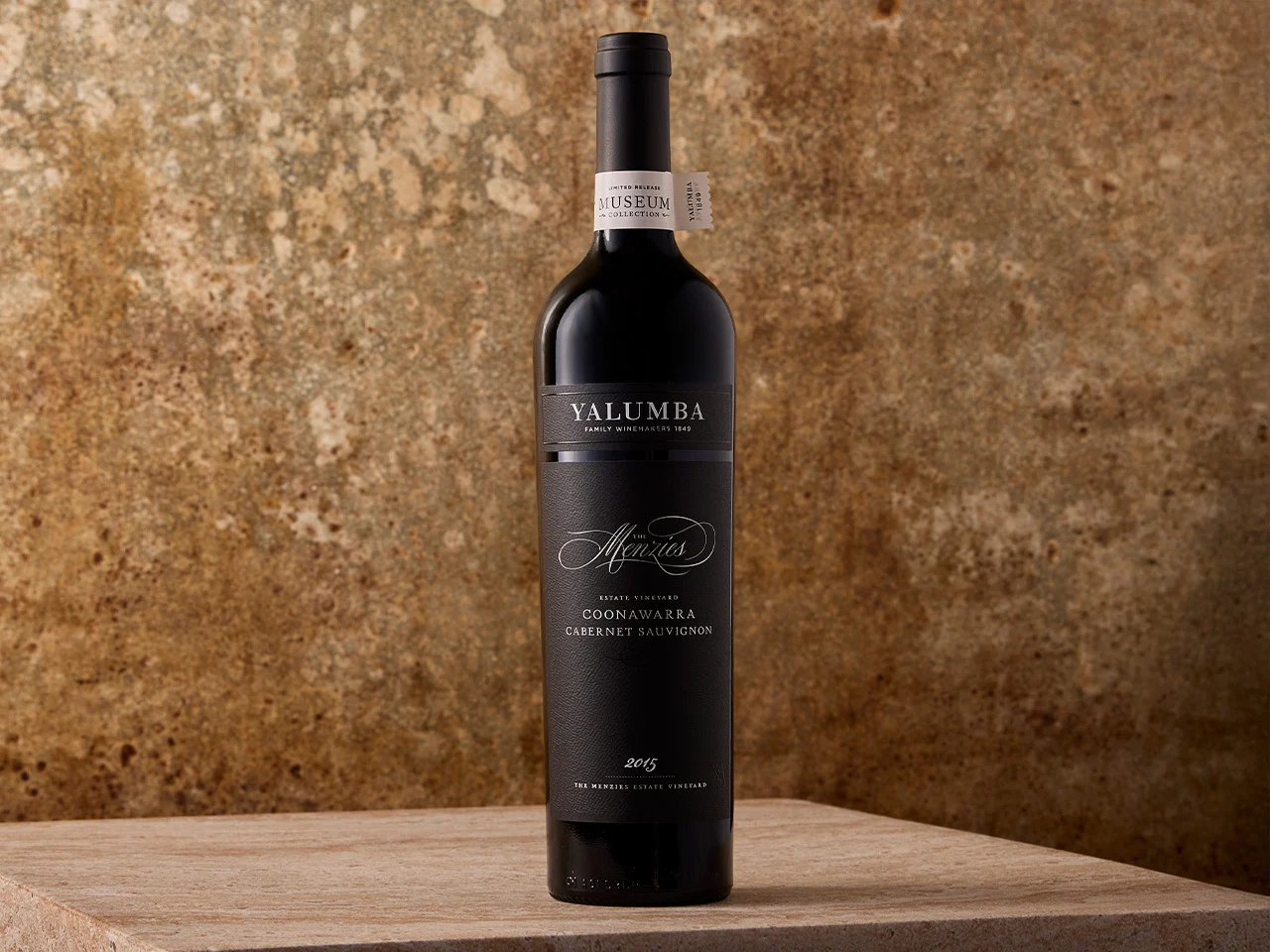 The Menzies Cabernet Sauvignon bottle on a wooden table