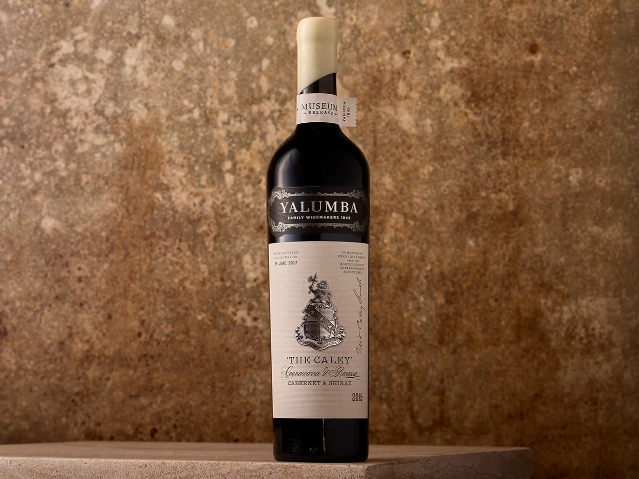 The Caley Cabernet & Shiraz bottle against textured rustic background