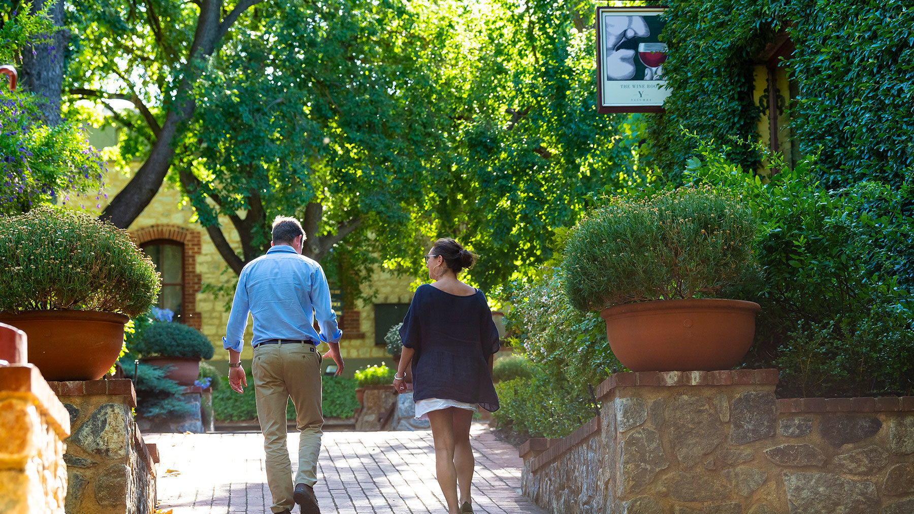 A couple walking down the stone steps at Yalumba