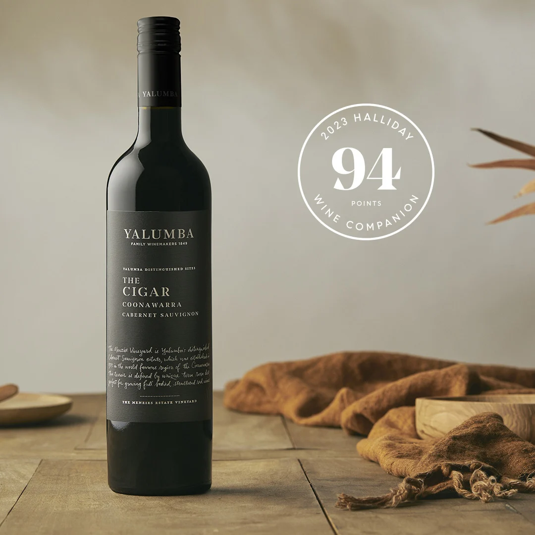 The Cigar Coonawarra Cabernet Sauvignon bottle with Halliday 94 points award on wooden table