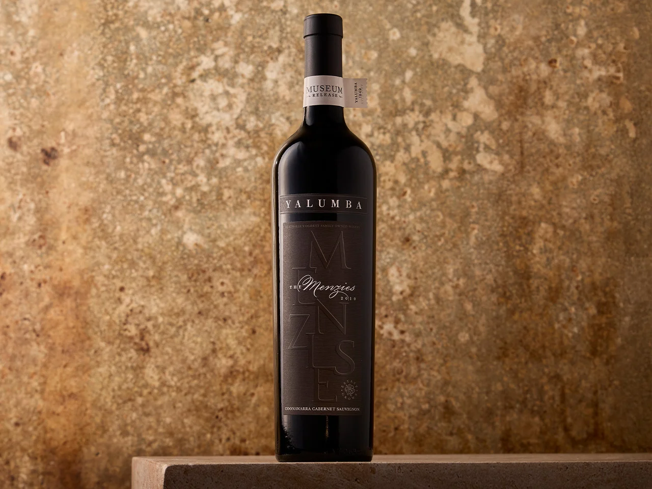 The Menzies Cabernet Sauvignon bottle on fabric with Halliday 95 points award