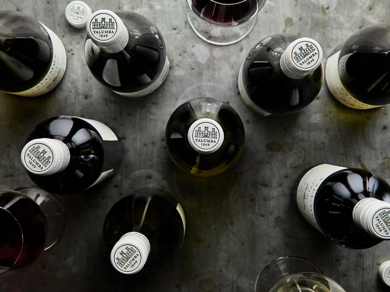 Overhead view of Yalumba wine bottles with branded capsules