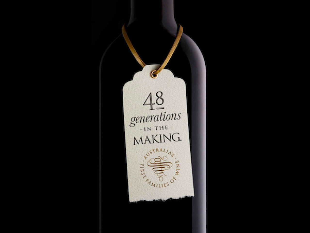 Wine bottle with First Families of Wine tag showing 48 generations in the making