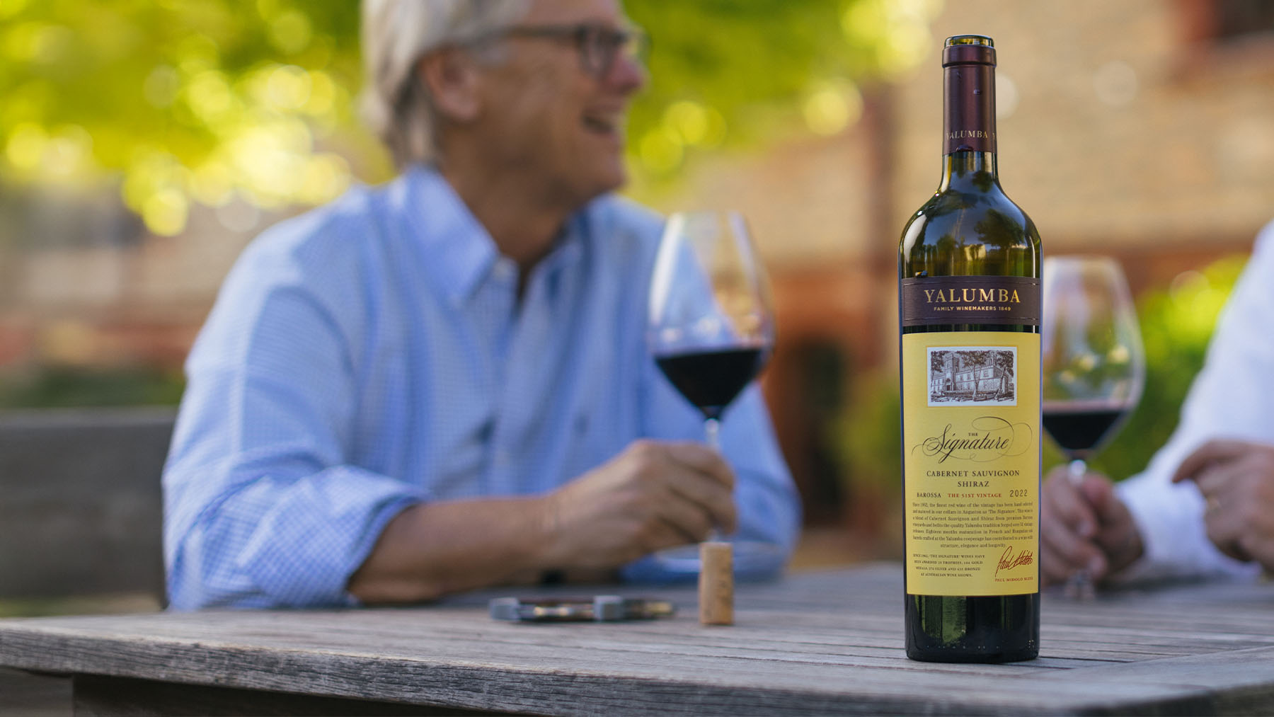 2022 Signature wine being held by the Signatory