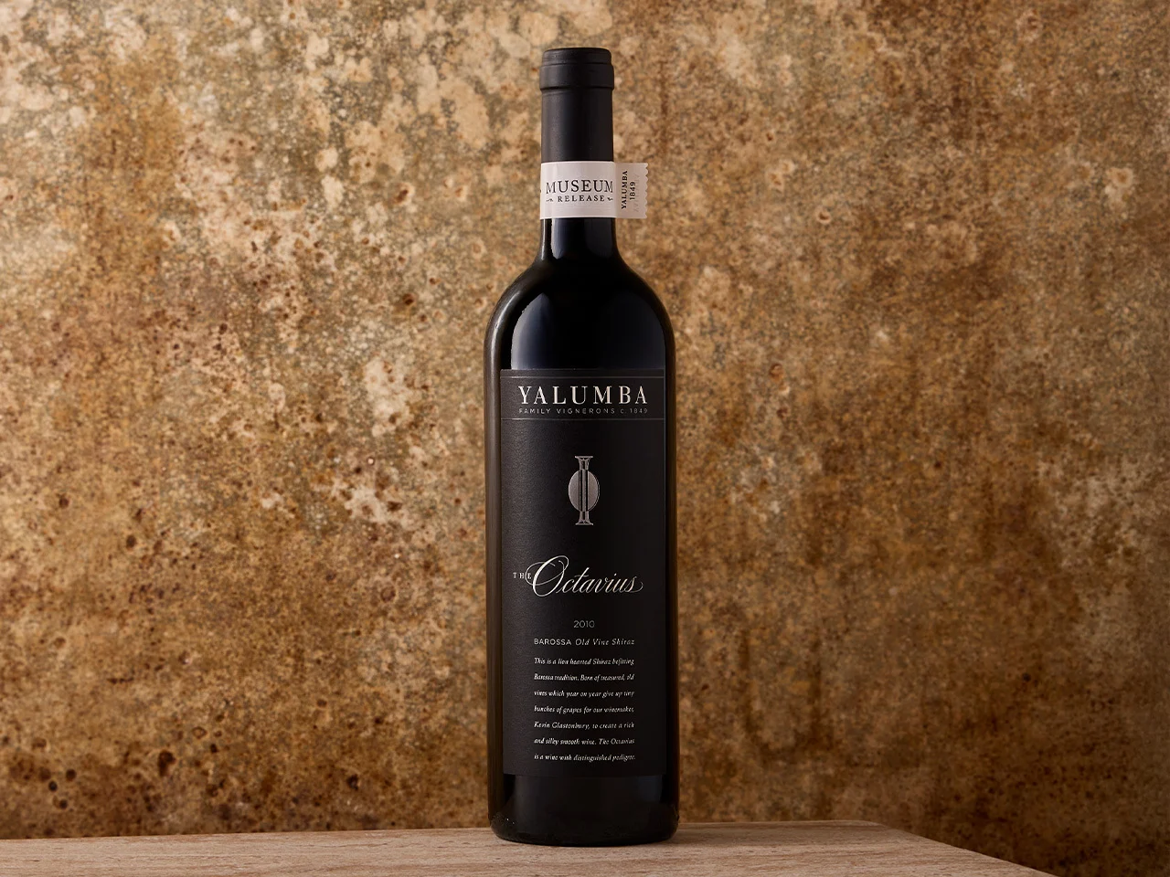The Octavius Shiraz bottle sits on a wooden benchtop