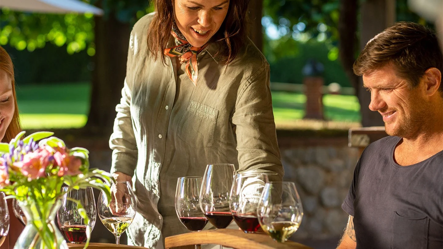 Three people enjoying a wine tasting at Yalumba