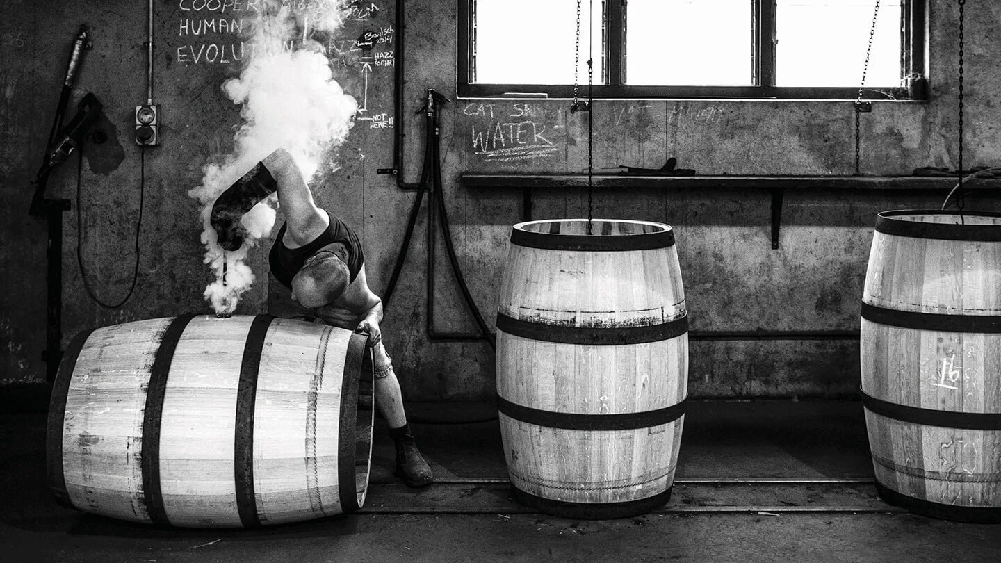 A man hand crafting a Yalumba wine barrel