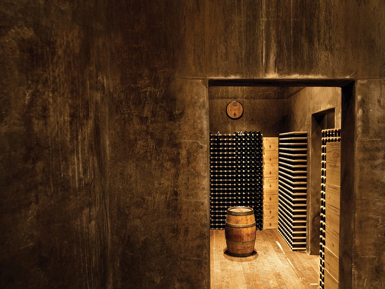 An image from inside the special cellar with wine bottles stored along all walls