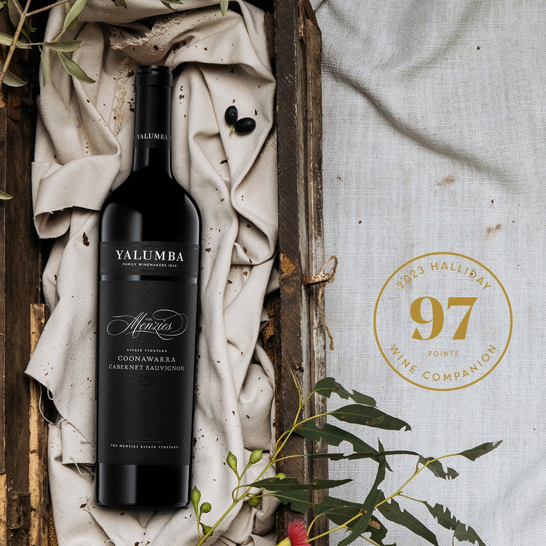 The Menzies Cabernet Sauvignon bottle on fabric with Halliday 97 points award